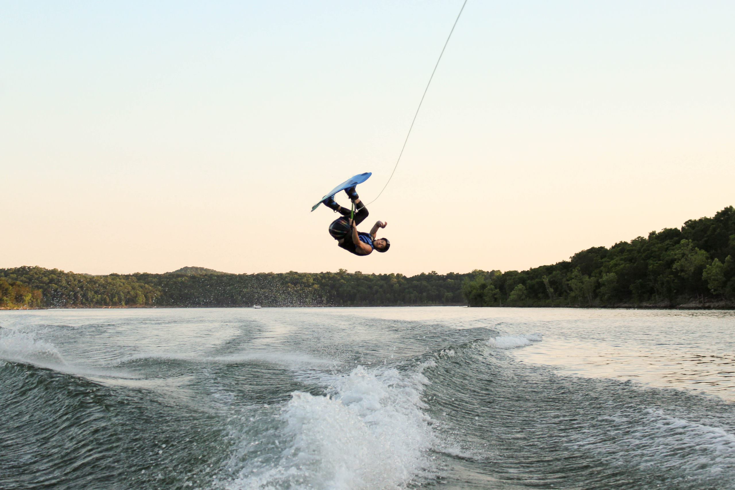 wakeboarder jumping on a wave
