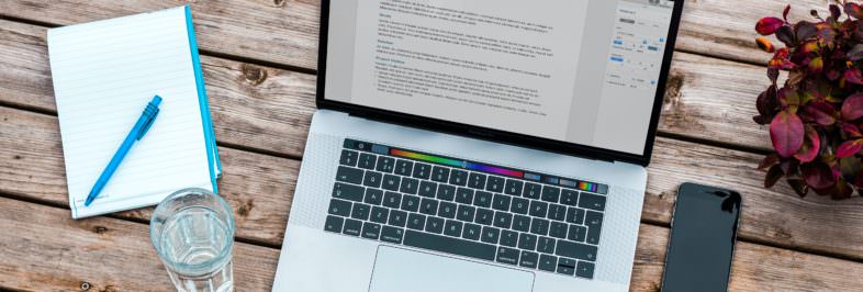 macbook on a wodden desk